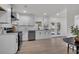 Spacious kitchen with stainless steel appliances, granite countertops, and access to the backyard at 212 Lake Moultrie Dr, Bonneau, SC 29431