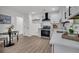 Bright kitchen featuring white cabinets, white subway tile backsplash, and stainless steel appliances at 212 Lake Moultrie Dr, Bonneau, SC 29431
