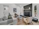 Bright living room with shiplap walls, a modern brick fireplace, and stylish neutral furniture at 212 Lake Moultrie Dr, Bonneau, SC 29431