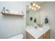 Well-lit bathroom showcasing a vanity, mirror, and stylish fixtures and accessories, enhancing functionality at 219 Tuscany Ct, Ladson, SC 29456