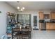 The dining area features seating for four and is adjacent to the kitchen, with a window view and easy patio access at 219 Tuscany Ct, Ladson, SC 29456