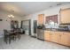 A view of the kitchen shows an eat-in dining area with a window and stainless steel dishwasher at 219 Tuscany Ct, Ladson, SC 29456