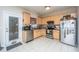 Functional kitchen with light wood cabinets, stainless appliances, and an exterior door for easy outdoor access at 219 Tuscany Ct, Ladson, SC 29456