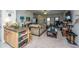 Open-concept living room with plush seating, a coffee table, and lots of natural light from nearby windows at 219 Tuscany Ct, Ladson, SC 29456