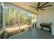 Spacious screened porch with ceiling fan, grill, and tranquil views of the surrounding greenery at 219 Tuscany Ct, Ladson, SC 29456