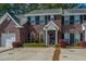Charming brick townhouse with well-manicured landscaping and a private driveway at 219 Tuscany Ct, Ladson, SC 29456
