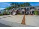 Attractive brick townhouse community featuring individual driveways and lush green trees at 219 Tuscany Ct, Ladson, SC 29456