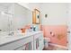 Bright bathroom with double sink vanity, ample mirror space, and unique scallop-themed decor at 226 Clydesdale Cir, Summerville, SC 29486
