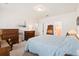 Comfortable bedroom features a light blue bedspread, soft carpet, and vintage wooden furniture at 226 Clydesdale Cir, Summerville, SC 29486