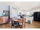 Cozy dining area features chandelier lighting and easy access to the kitchen with stainless steel appliances at 226 Clydesdale Cir, Summerville, SC 29486