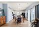 An open dining area showcases stylish chandelier, hardwood flooring, and seamless access to kitchen at 226 Clydesdale Cir, Summerville, SC 29486