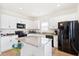 Bright kitchen features white cabinets, granite countertops, stainless steel appliances and center island at 226 Clydesdale Cir, Summerville, SC 29486