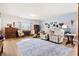 Spacious living room boasts hardwood floors, neutral decor, and an abundance of natural light at 226 Clydesdale Cir, Summerville, SC 29486
