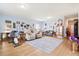Expansive living room boasts hardwood floors, neutral decor, and lots of natural light at 226 Clydesdale Cir, Summerville, SC 29486
