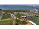 An aerial view of the baseball and athletic fields with the bridge and cityscape in the distance at 233 S Plaza Ct # 210, Mount Pleasant, SC 29464