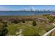 A scenic aerial view featuring a waterfront property with a glimpse of the bridge in the background at 233 S Plaza Ct # 210, Mount Pleasant, SC 29464