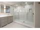 Bright bathroom featuring an elegant double vanity and a spacious walk-in shower with sleek glass doors at 233 S Plaza Ct # 210, Mount Pleasant, SC 29464