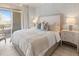 Serene bedroom featuring a plush bed, soft lighting, and access to a private balcony at 233 S Plaza Ct # 210, Mount Pleasant, SC 29464