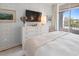 Bright bedroom featuring a balcony and a stylish dresser with decor at 233 S Plaza Ct # 210, Mount Pleasant, SC 29464