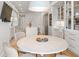 Open concept kitchen and dining area, glass cabinets and an island at 233 S Plaza Ct # 210, Mount Pleasant, SC 29464