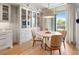 Dining area features a table with four chairs and built-in glass cabinets at 233 S Plaza Ct # 210, Mount Pleasant, SC 29464