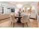 Open concept dining area with chandelier, wood floors, and connected living room at 233 S Plaza Ct # 210, Mount Pleasant, SC 29464