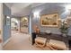 Chic hallway with arched doorways, built-in shelving, designer wallpaper, and stylish decor at 233 S Plaza Ct # 210, Mount Pleasant, SC 29464