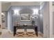 Entryway with designer wallpaper, sconces, table, seating, and wood flooring showcases sophisticated design at 233 S Plaza Ct # 210, Mount Pleasant, SC 29464