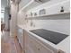 Bright kitchen countertop features marble backsplash, modern appliances, and gold hardware at 233 S Plaza Ct # 210, Mount Pleasant, SC 29464