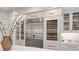 Kitchen features stainless steel refrigerator, wine cooler, and glass cabinets at 233 S Plaza Ct # 210, Mount Pleasant, SC 29464