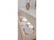 Kitchen island features open drawer showcasing the dishware inside at 233 S Plaza Ct # 210, Mount Pleasant, SC 29464