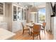 Open kitchen and dining area featuring a light table and views out to the balcony at 233 S Plaza Ct # 210, Mount Pleasant, SC 29464