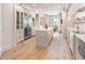 Well-designed kitchen with a kitchen island, stainless steel appliances, and access to a balcony at 233 S Plaza Ct # 210, Mount Pleasant, SC 29464