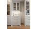 Kitchen features glass cabinets and drawers with gold hardware at 233 S Plaza Ct # 210, Mount Pleasant, SC 29464