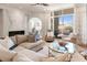 Inviting living room with a marble fireplace, plush seating, and floor to ceiling windows overlooking the balcony at 233 S Plaza Ct # 210, Mount Pleasant, SC 29464