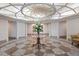 Opulent lobby with unique circular ceiling, elegant flooring, and decorative floral arrangement at 233 S Plaza Ct # 210, Mount Pleasant, SC 29464