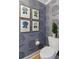 Charming powder room featuring elegant floral wallpaper, a modern toilet, and stylish decor at 233 S Plaza Ct # 210, Mount Pleasant, SC 29464