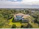 Majestic home surrounded by mature trees and greenery in a peaceful neighborhood setting at 24 Waterway Island Dr, Isle of Palms, SC 29451