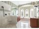 Spacious bathroom features a glass-enclosed shower, soaking tub, and dual vanities at 24 Waterway Island Dr, Isle of Palms, SC 29451