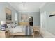 Light-filled bedroom features neutral walls, coastal decor, and hardwood floors at 24 Waterway Island Dr, Isle of Palms, SC 29451