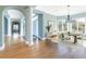 Elegant dining room features hardwood floors, large windows, and decorative lighting at 24 Waterway Island Dr, Isle of Palms, SC 29451