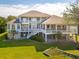 Beautiful home with expansive decks, lush greenery, and well-maintained grounds at 24 Waterway Island Dr, Isle of Palms, SC 29451