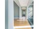 Open hallway with hardwood floors and white columns at 24 Waterway Island Dr, Isle of Palms, SC 29451