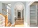 Foyer features an arched hallway with hardwood floors and a view of the stairway at 24 Waterway Island Dr, Isle of Palms, SC 29451