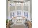 Open living room with high ceilings, natural light and hardwood floors at 24 Waterway Island Dr, Isle of Palms, SC 29451
