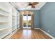 Office with built-in bookcases and a sliding glass door leading to a balcony at 24 Waterway Island Dr, Isle of Palms, SC 29451
