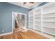 Office space features built-in shelving, hardwood floors, and modern trim at 24 Waterway Island Dr, Isle of Palms, SC 29451