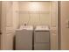 Brightly lit laundry room with new washer and dryer units and wire shelving at 2404 Scarlett Maple St, Summerville, SC 29486