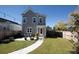 Beautiful backyard with patio, string lights, and well-maintained lawn at 251 Summers Dr, Summerville, SC 29485