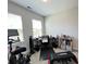 Versatile bedroom that has a home office and workout space near two windows at 251 Summers Dr, Summerville, SC 29485